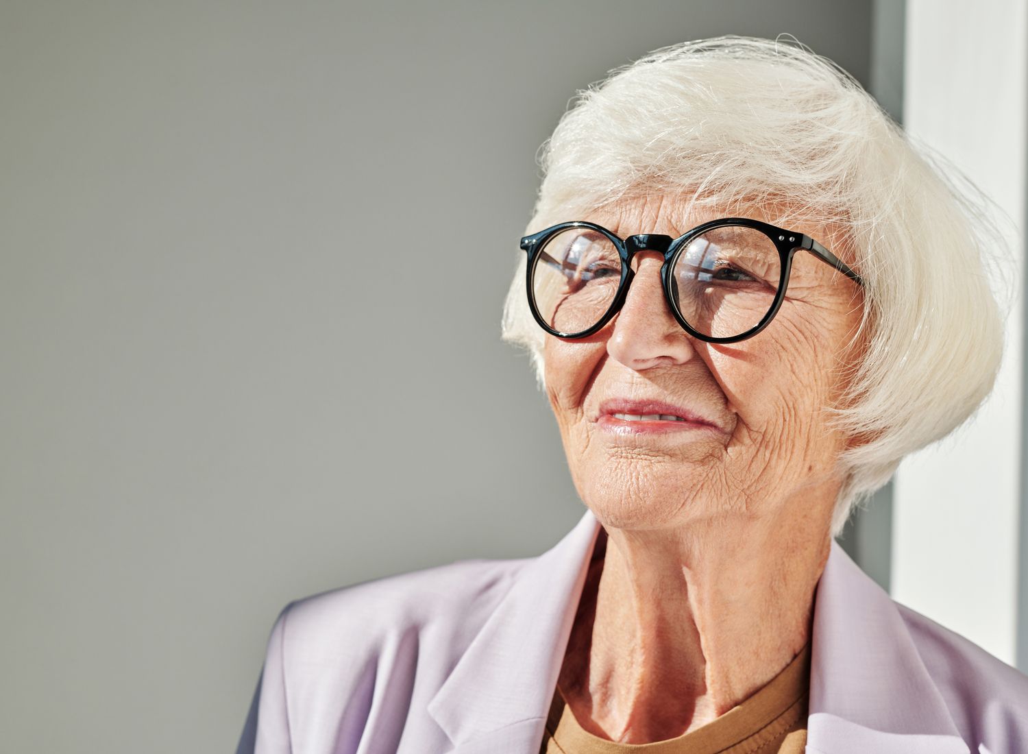 A smiling senior woman in a care community
