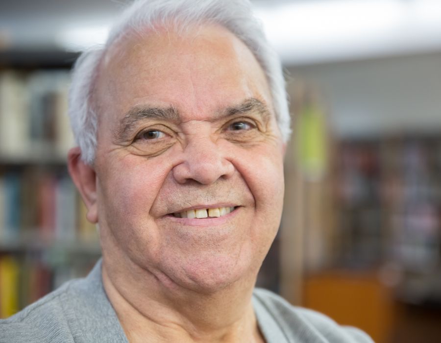A senior man smiling warmly